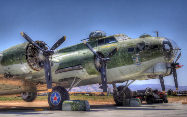 HD desktop wallpaper featuring a close-up view of a military Boeing B-17 Flying Fortress aircraft under clear blue skies.