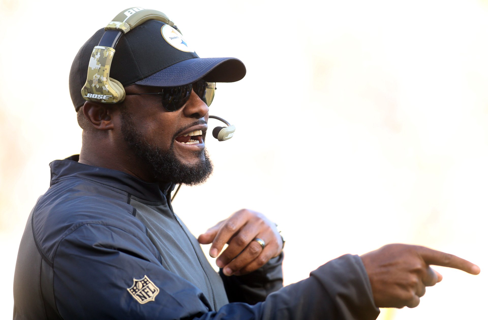 A Pittsburgh Steelers coach wearing a headset and sunglasses, actively giving instructions during a game, captured in a 4K Ultra HD PC desktop wallpaper.