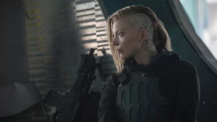 HD desktop wallpaper featuring Natalie Dormer as Cressida from the movie The Hunger Games: Mockingjay – Part 1, showcasing her intense side profile in tactical gear.
