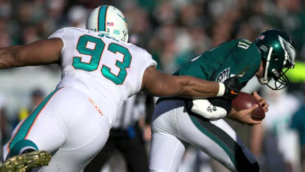 Miami Dolphins defensive lineman #93 sacks an opposing quarterback in-game — HD Miami Dolphins sports scene, PC desktop wallpaper and background.