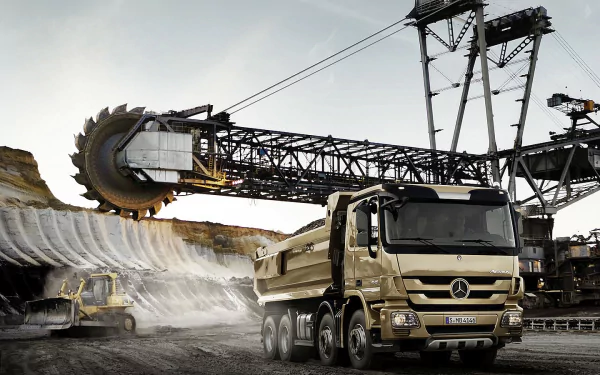HD PC desktop wallpaper and background of a Mercedes‑Benz dump truck beside a giant excavator in an open‑pit mine, industrial vehicle and heavy machinery scene.