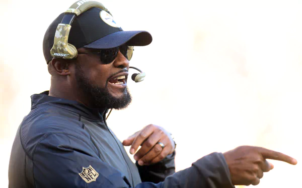 A Pittsburgh Steelers coach wearing a headset and sunglasses, actively giving instructions during a game, captured in a 4K Ultra HD PC desktop wallpaper.