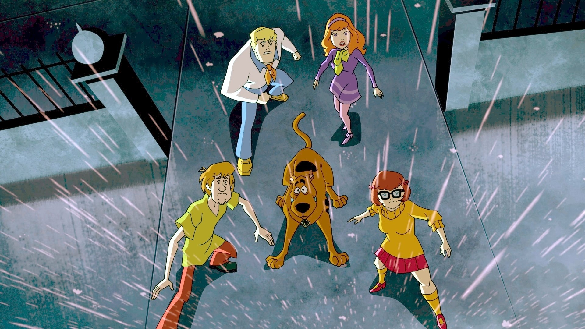 HD PC desktop wallpaper featuring the Scooby-Doo TV show gang—Shaggy, Fred, Daphne, Velma, and Scooby—standing together in the rain looking upward.