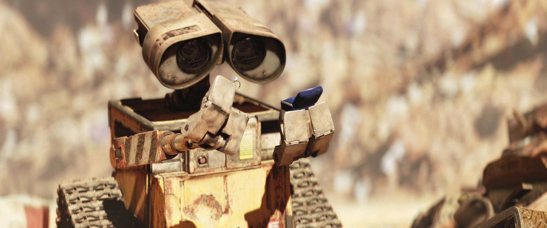 HD PC desktop wallpaper featuring Wall·E from the movie, gently holding a blue butterfly against a softly blurred background.