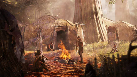 A vibrant HD desktop wallpaper from Far Cry Primal, depicting a prehistoric camp scene with characters gathered around a fire, set against a lush forest backdrop.
