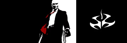 HD PC desktop wallpaper featuring the Hitman video game character in a black suit with red accents, holding dual pistols against a stark black and white background.
