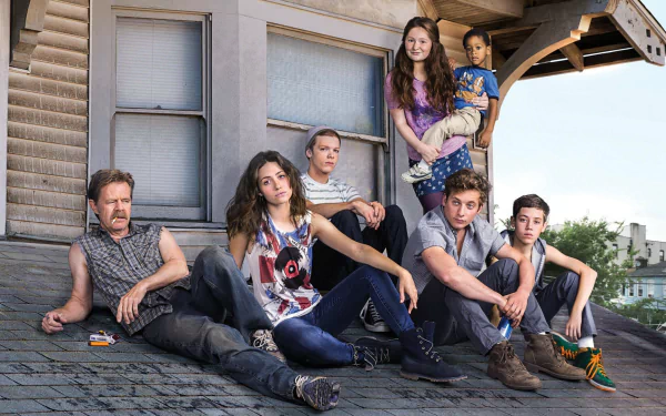 A group of characters from the TV show Shameless relax on a rooftop, showcasing their unique personalities and dynamic relationships in this HD desktop wallpaper.