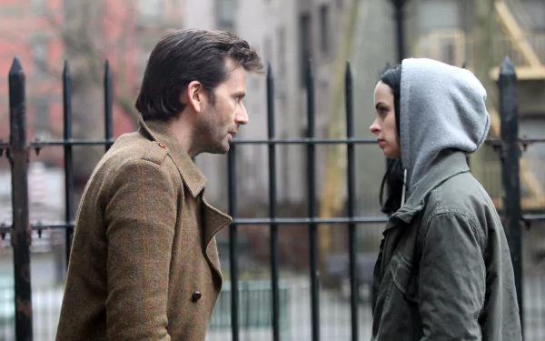 David Tennant as Purple Man and Krysten Ritter as Jessica Jones face off in a tense scene from the TV show Jessica Jones, captured in 4K Ultra HD wallpaper quality.