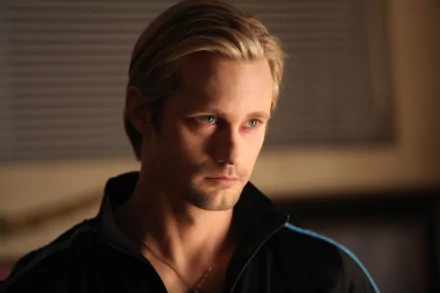 Close-up of a brooding blond man in dim light, styled as an HD PC desktop wallpaper inspired by the TV vampire drama True Blood.