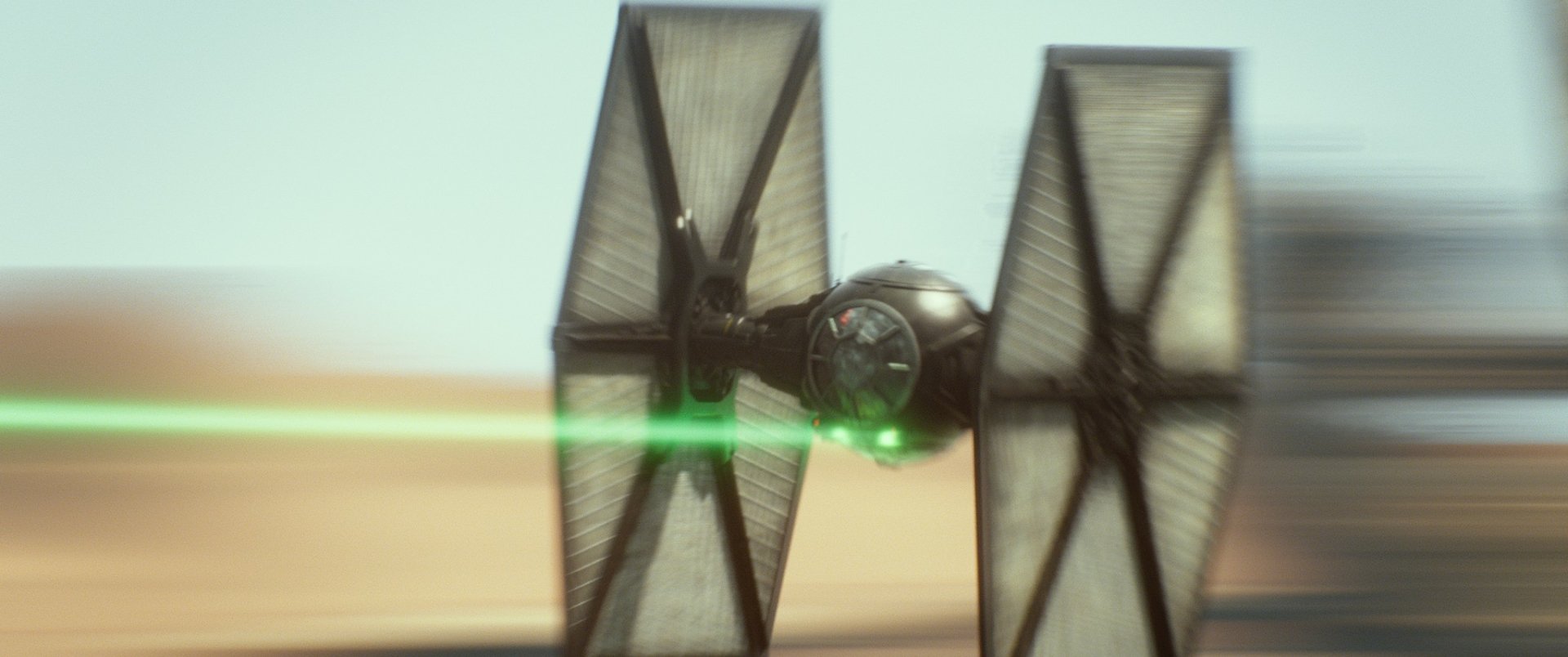 HD desktop wallpaper featuring a TIE Fighter from Star Wars Episode VII: The Force Awakens, capturing the iconic movie spacecraft in dynamic flight.