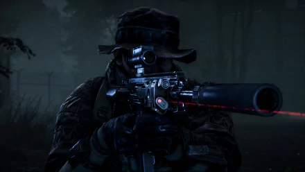 A soldier from Battlefield 4 aims a sniper rifle with a laser sight in a dark, misty forest at night. The image serves as a high-definition desktop wallpaper and background.
