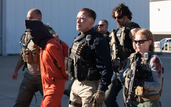 Dynamic HD wallpaper featuring Arnold Schwarzenegger and a team in tactical gear from the movie Sabotage (2014), showcasing intense action and drama.