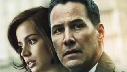HD desktop wallpaper: close-up of two actors in a tense scene from the film Exposed — a woman looking aside and a man staring ahead with concern.