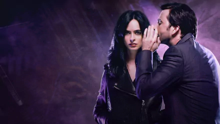 David Tennant as the Purple Man whispers to Krysten Ritter's Jessica Jones in this dramatic HD wallpaper from the TV show, capturing a tense moment between the two characters.