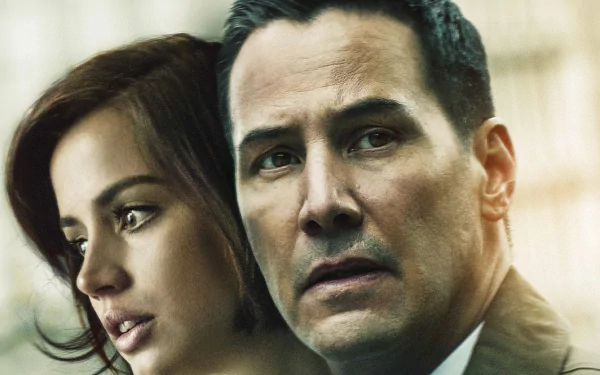 HD desktop wallpaper: close-up of two actors in a tense scene from the film Exposed — a woman looking aside and a man staring ahead with concern.