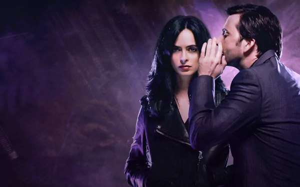 David Tennant as the Purple Man whispers to Krysten Ritter's Jessica Jones in this dramatic HD wallpaper from the TV show, capturing a tense moment between the two characters.