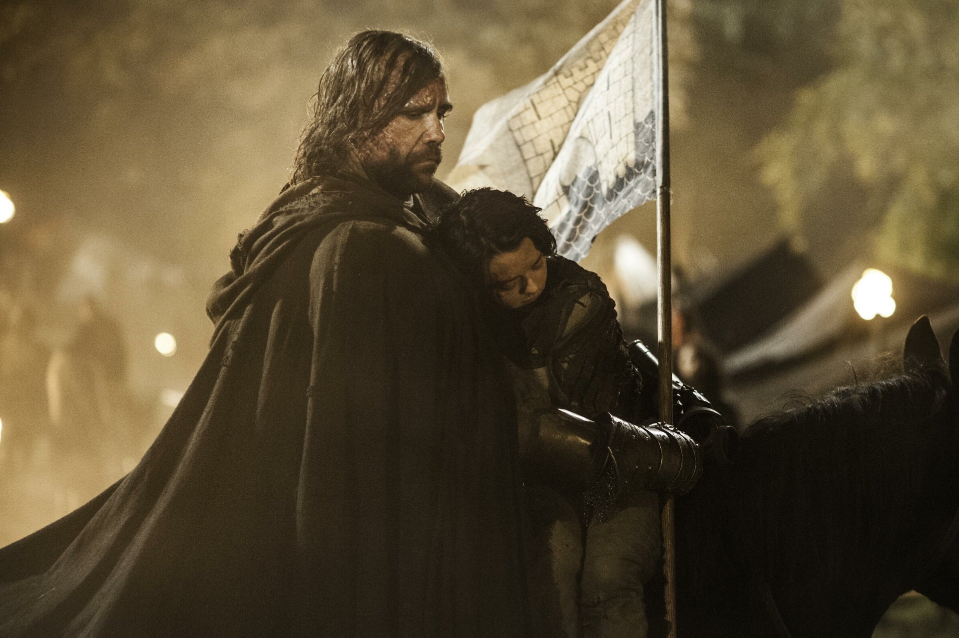 HD wallpaper featuring Rory McCann as Sandor Clegane and Maisie Williams as Arya Stark from the TV show Game of Thrones, set in a dimly lit medieval scene.