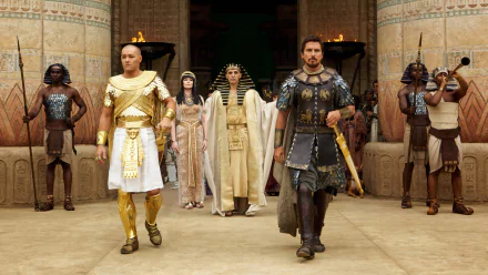 HD PC desktop wallpaper from the movie Exodus: Gods and Kings, featuring key characters in ancient Egyptian attire within a grand temple setting.