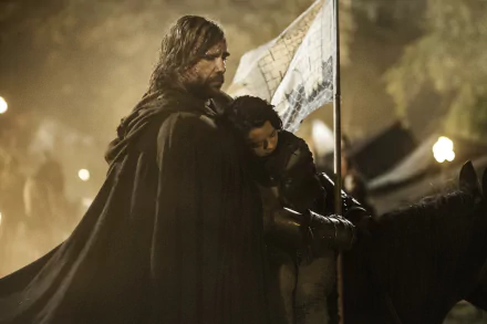 HD wallpaper featuring Rory McCann as Sandor Clegane and Maisie Williams as Arya Stark from the TV show Game of Thrones, set in a dimly lit medieval scene.