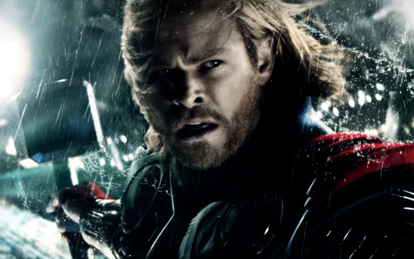 HD desktop wallpaper of Chris Hemsworth as Thor in a dramatic movie scene, featuring intense expressions and dynamic lighting effects.