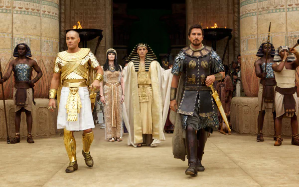 HD PC desktop wallpaper from the movie Exodus: Gods and Kings, featuring key characters in ancient Egyptian attire within a grand temple setting.