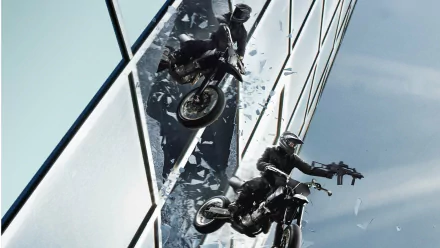 HD PC desktop wallpaper from the movie Point Break (2015) showing two motorcyclists performing a stunt on glass structures against a clear sky.