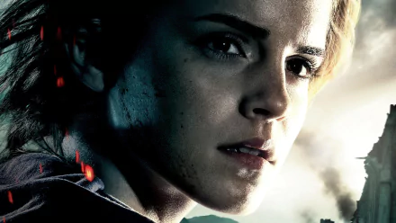 Close-up of Hermione Granger, portrayed by Emma Watson, from Harry Potter and the Deathly Hallows: Part 2, showcasing her determined expression in a dramatic HD movie wallpaper.
