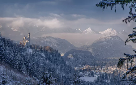 A breathtaking winter landscape of Neuschwanstein Castle in Germany, surrounded by snowy mountains and dense evergreen trees, creating a serene and picturesque scene.