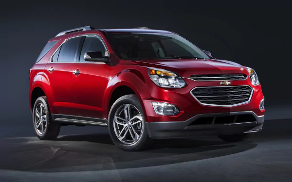 Red Chevrolet Equinox SUV car on a dark studio backdrop — 2K Quad HD PC desktop wallpaper and background.