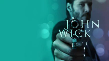 High-definition wallpaper featuring Keanu Reeves as John Wick, holding a gun against a vibrant backdrop, exuding action and intensity from the iconic movie series.