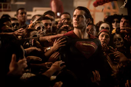 HD wallpaper featuring Henry Cavill as Superman in a scene from Batman V Superman: Dawn Of Justice, surrounded by a crowd reaching out towards him.