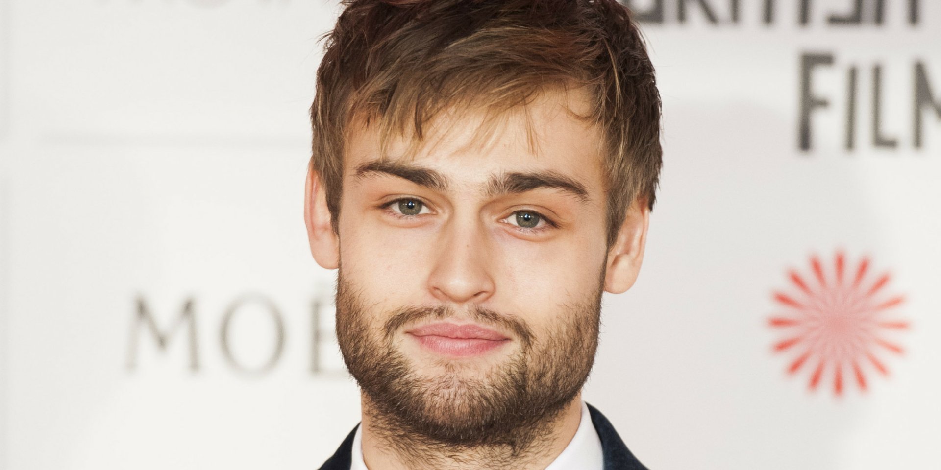 HD desktop wallpaper featuring English actor and celebrity Douglas Booth with a close-up portrait.