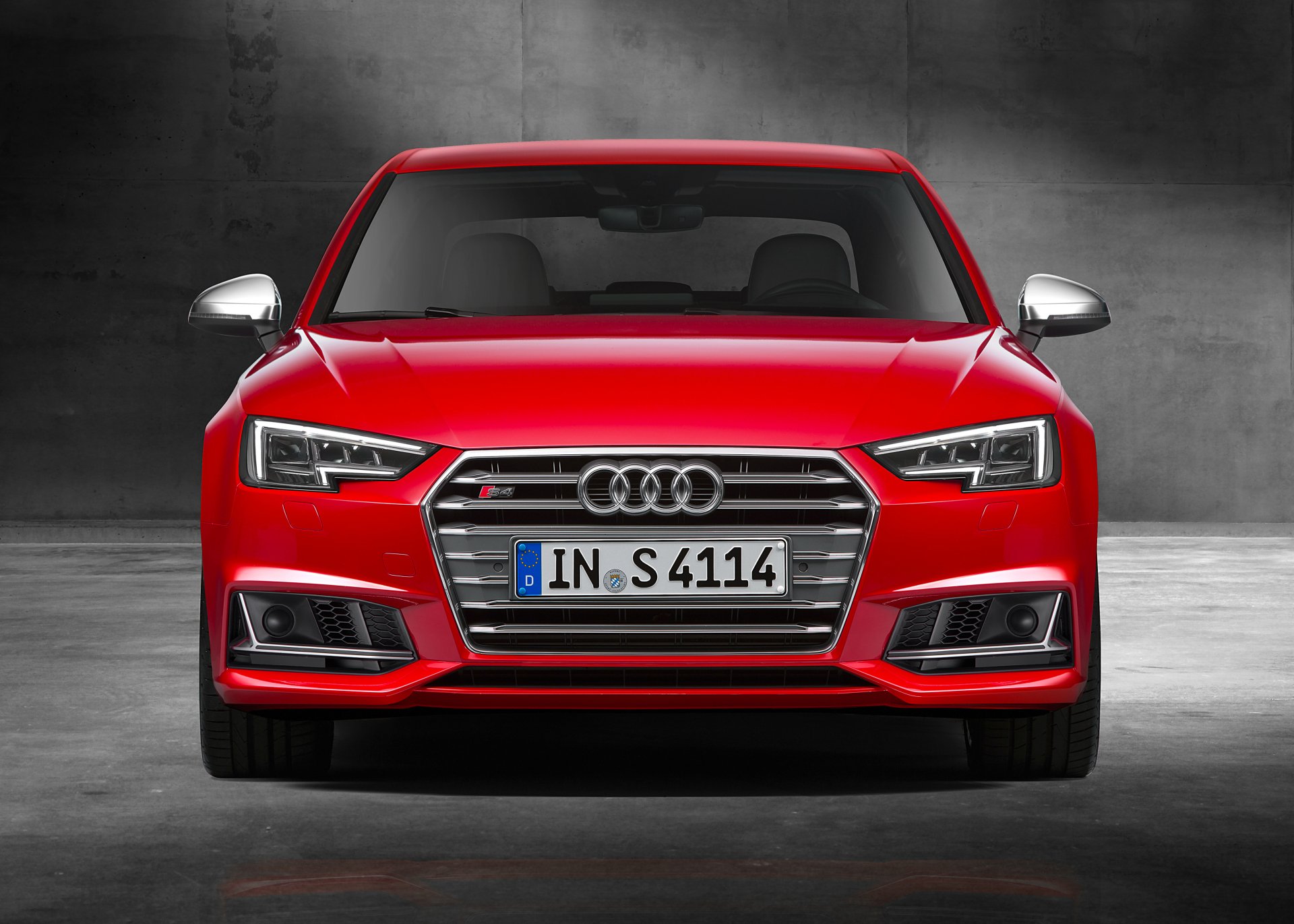 Front view of a red Audi S4 car against a dark background, showcased in a 4K Ultra HD PC desktop wallpaper and background.