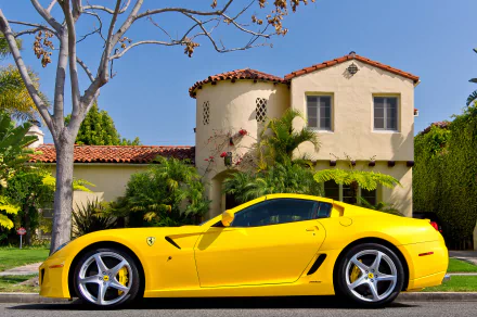 Yellow Ferrari SA Aperta sports car parked before a Mediterranean-style house — HD PC desktop wallpaper and background