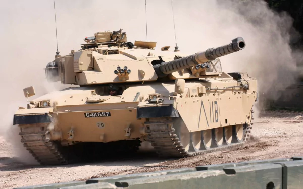 Desert-camouflaged Challenger 1 main battle tank kicking up dust on a training ground — HD military tank PC desktop wallpaper.