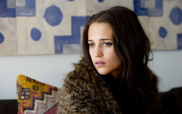 Portrait of Swedish actress Alicia Vikander with brown eyes and brunette hair, featured in a 4K Ultra HD desktop wallpaper.