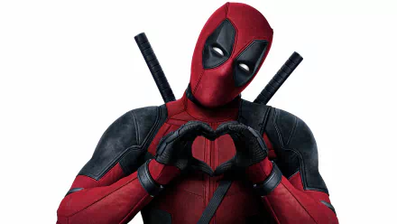 HD wallpaper featuring Deadpool forming a heart shape with his hands.