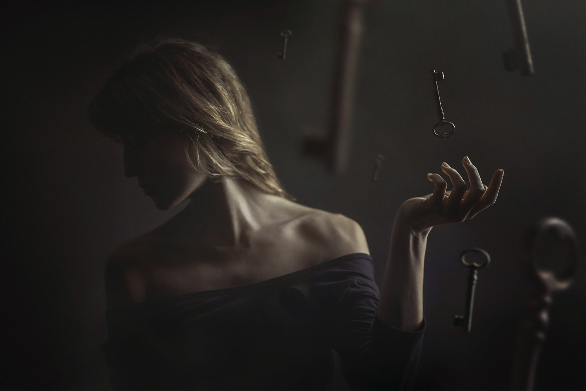 HD desktop wallpaper featuring a blonde woman surrounded by floating keys, captured with artistic photography and digital manipulation.