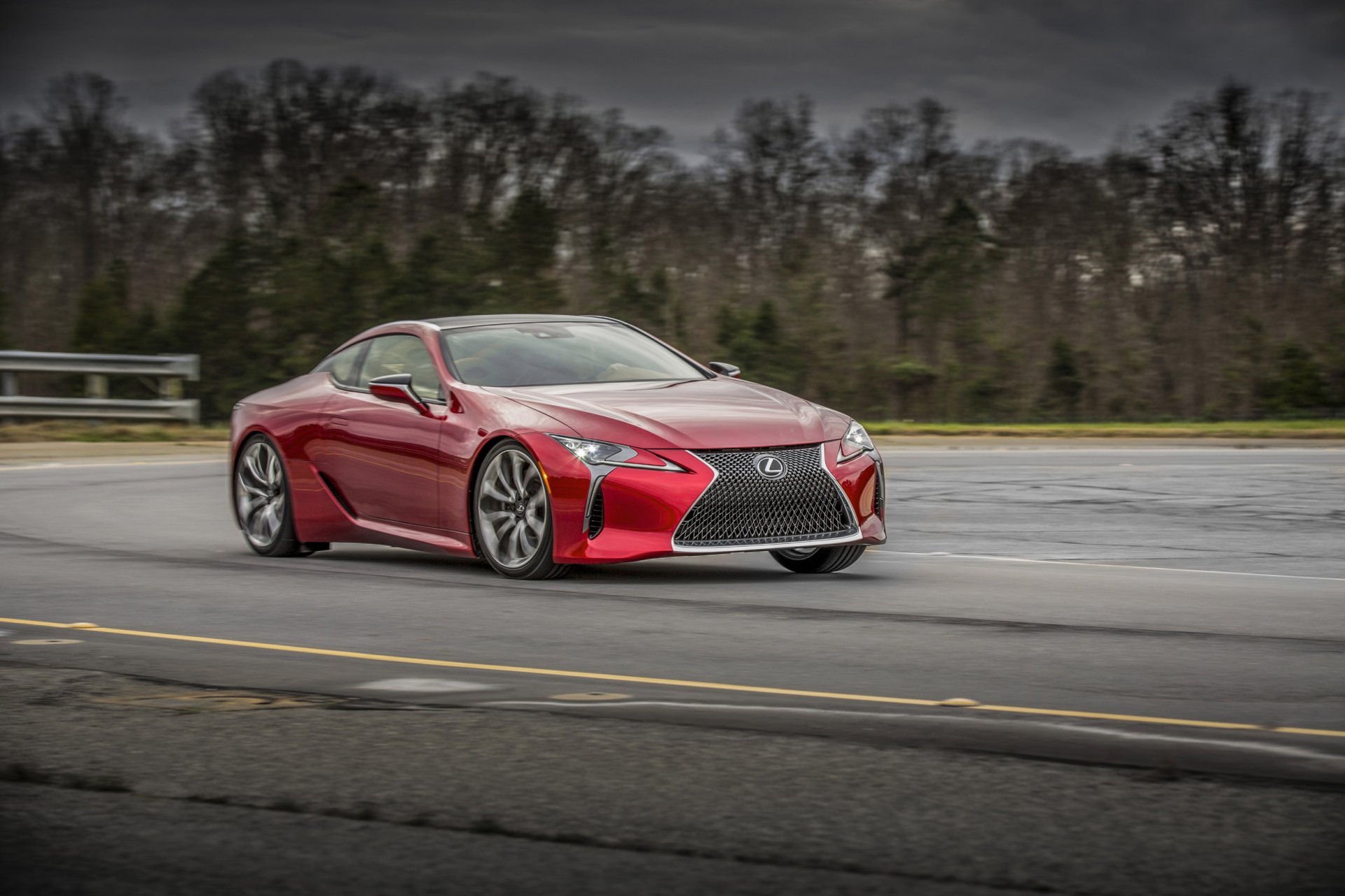 Red Lexus LC 500 sports vehicle on a wet road, captured as an HD PC desktop wallpaper and background.