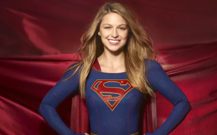 HD desktop wallpaper of Melissa Benoist as Supergirl from the TV show Supergirl, featuring her in superhero attire with a red backdrop.