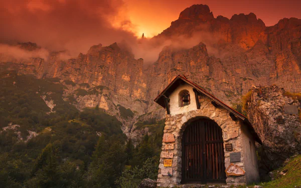  Chapel dwarfed by the steep face of Mount Shiara in the Dolomites. by Steve Thompson