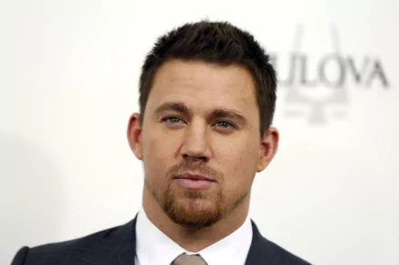 HD desktop wallpaper featuring American actor and celebrity Channing Tatum in a formal suit at a public event.