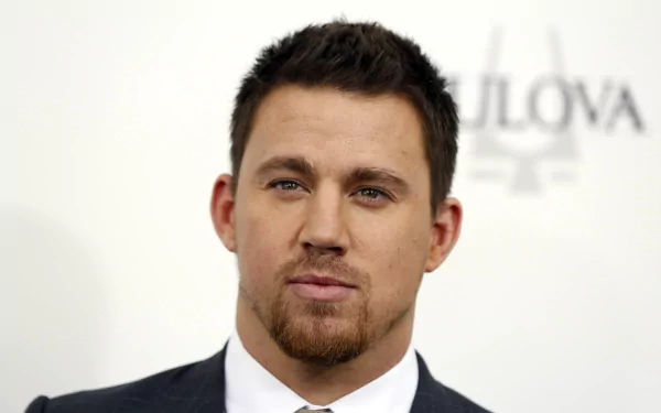 HD desktop wallpaper featuring American actor and celebrity Channing Tatum in a formal suit at a public event.