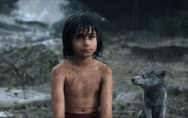 A scene from the movie The Jungle Book (2016), featuring a young boy sitting in the rain with a wolf pup, capturing the adventurous spirit of the film. HD desktop wallpaper.