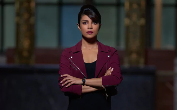 HD desktop wallpaper featuring Priyanka Chopra from the TV show Quantico, with a confident pose and dark, dramatic background.