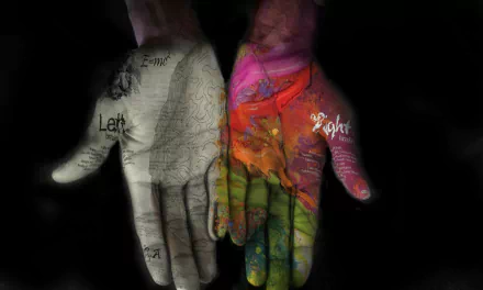 An artistic HD wallpaper featuring two hands—one adorned with colorful paint and the other with intricate designs—set against a black background, showcasing creativity and contrast.