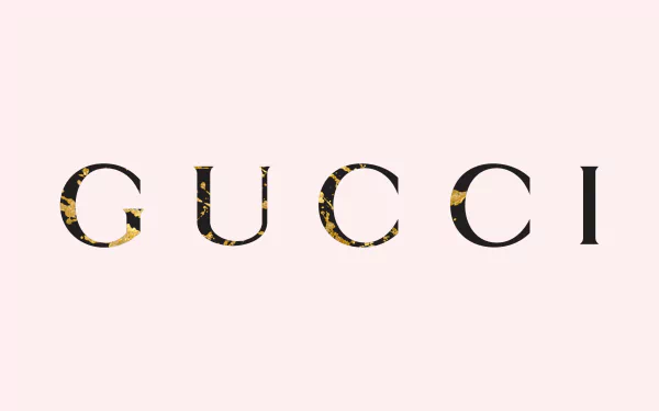HD PC desktop wallpaper featuring the man-made Gucci logo with a stylish, minimalist design on a soft pink background.