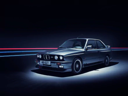 HD desktop wallpaper featuring a sleek BMW 3 Series vehicle in a dark setting with dynamic light trails, showcasing the car’s classic design and sporty appeal.