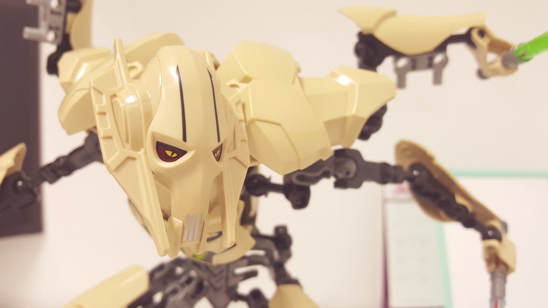 A detailed LEGO figurine of General Grievous from Star Wars, showcasing its intricate design and striking features, set against a soft blurred background in 4K Ultra HD.