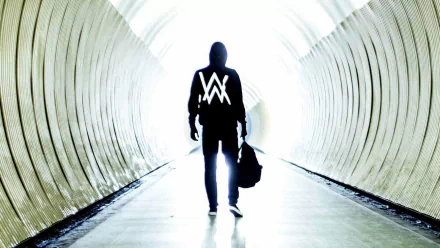 HD desktop wallpaper featuring a silhouette of a DJ in a tunnel, with the signature AW logo of Alan Walker illuminated on the hoodie. The background exudes a mysterious and energetic vibe.